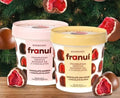 Dos vasitos de bombones Franuí, frambuesas bañadas en chocolate amargo y en chocolate con leche